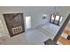 Open living room featuring a black marble fireplace and tile floors at 4760 Meredith Ln, Sarasota, FL 34241