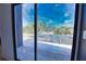 Beautiful outdoor view from home's sliding glass doors showing pool and landscaping at 4760 Meredith Ln, Sarasota, FL 34241