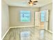 Bright and airy bedroom with wood-look tile floors and a ceiling fan at 8283 47Th Street E Cir, Palmetto, FL 34221