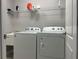 Laundry room with appliances, utility sink, and storage shelf at 8283 47Th Street E Cir, Palmetto, FL 34221