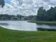 Scenic view of a tranquil pond surrounded by trees at 8283 47Th Street E Cir, Palmetto, FL 34221