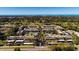 A stunning aerial view of the condo complex, highlighting golf course and proximity to the ocean at 12300 Vonn Rd # 7203, Largo, FL 33774