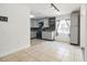 A kitchen featuring tile floors and grey cabinetry at 1321 Groveland Ave, Venice, FL 34285