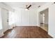 Living area with wood floors, natural light, and direct access to the front porch at 1321 Groveland Ave, Venice, FL 34285