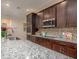 Gourmet kitchen boasts modern appliances and granite countertops at 25172 Calusa Dr, Punta Gorda, FL 33955