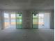 Unfinished living area with sliding glass doors overlooking the water at 25172 Calusa Dr, Punta Gorda, FL 33955