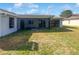 Large backyard showcasing a screened lanai at 3402 Rankin Dr, New Port Richey, FL 34655