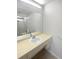 Well-lit bathroom featuring a vanity with a large mirror and a shower/tub combo at 3402 Rankin Dr, New Port Richey, FL 34655