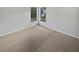 Bright bedroom with two windows and neutral carpet at 3402 Rankin Dr, New Port Richey, FL 34655