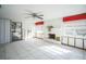 Bright living room featuring a white brick fireplace and tile flooring at 7840 Gulf Way, Hudson, FL 34667