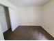 Inviting bedroom featuring a neutral carpet and built-in closet, offering comfort and functional storage at 4034 Dream Oak Pl # 104, Tampa, FL 33613