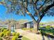 Beautiful community area near the pool featuring lush greenery and a parking area at 4034 Dream Oak Pl # 104, Tampa, FL 33613