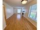 Spacious living room with gleaming laminate floors and natural light, creating a warm and inviting atmosphere at 4034 Dream Oak Pl # 104, Tampa, FL 33613