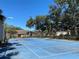 A blue outdoor tennis court is available for residents to enjoy in a private setting at 4034 Dream Oak Pl # 104, Tampa, FL 33613
