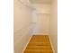 This spacious walk-in closet features wire shelving and plank floors for organized storage at 4034 Dream Oak Pl # 104, Tampa, FL 33613