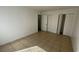 Tiled floor bedroom featuring white walls, a walk-in closet and neutral finishes at 7502 Needle Leaf Pl # B66, Tampa, FL 33617