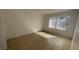 Clean bedroom with tile flooring, window with blinds, and neutral paint at 7502 Needle Leaf Pl # B66, Tampa, FL 33617