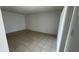 Bedroom with tile flooring, white walls, and closet at 7502 Needle Leaf Pl # B66, Tampa, FL 33617