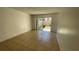 Bright living room with tile flooring and sliding glass doors to the exterior at 7502 Needle Leaf Pl # B66, Tampa, FL 33617