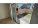View from living room to a fenced patio with landscaping at 7502 Needle Leaf Pl # B66, Tampa, FL 33617