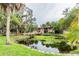 Overhead bridge over pond offers residents walking access and viewing opportunity at 7502 Needle Leaf Pl # B66, Tampa, FL 33617