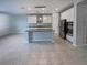 Bright, open kitchen boasts an island, stainless appliances, and ample counter space for cooking and entertaining guests at 6525 Dutton Dr, Wesley Chapel, FL 33545
