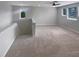 Upstairs loft area with carpet, windows and ceiling fan at 6525 Dutton Dr, Wesley Chapel, FL 33545