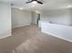 Upstairs loft area with carpet and ceiling fan at 6525 Dutton Dr, Wesley Chapel, FL 33545