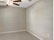 Bedroom with ceiling fan and neutral colored walls at 13507 Willow Bluestar Loop, Riverview, FL 33579