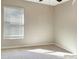 Bright bedroom with window and carpet flooring at 13507 Willow Bluestar Loop, Riverview, FL 33579