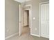 Neutral bedroom with carpet, a closet and doorway leading to a bathroom or another room at 13507 Willow Bluestar Loop, Riverview, FL 33579