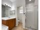 Bathroom featuring a vanity with solid surface countertop, a glass enclosed shower, and tile flooring at 3328 Circleville St, North Port, FL 34286