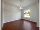 The living room has cherry-wood floors and a large window for lots of light at 3328 Circleville St, North Port, FL 34286