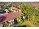 Aerial view highlighting well-maintained landscaping and lush surroundings surrounding condo buildings at 1801 E Lake Rd # 3A, Palm Harbor, FL 34685