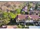 Aerial view of condo community boasting lush landscape and red-tiled roofs at 1801 E Lake Rd # 3A, Palm Harbor, FL 34685