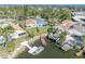 An aerial view of the home, boat dock, and surrounding community at 4522 Marine Pkwy, New Port Richey, FL 34652