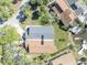 An aerial view of the property, showing the roof, driveway, yard, and waterfront access at 4522 Marine Pkwy, New Port Richey, FL 34652