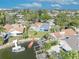 This aerial shot features the house, nearby docks, and picturesque waterways at 4522 Marine Pkwy, New Port Richey, FL 34652