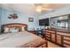 Well-furnished bedroom with modern decor, a ceiling fan, light blue walls, and a large comfortable bed at 26058 Paysandu Dr, Punta Gorda, FL 33983