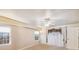 Bright bedroom with large windows, neutral carpet, and a ceiling fan at 26058 Paysandu Dr, Punta Gorda, FL 33983