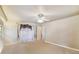Large bedroom with neutral walls, beige carpet, large window with curtains, and ample natural light at 26058 Paysandu Dr, Punta Gorda, FL 33983