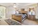Bedroom suite with stylish decor, neutral carpet, and a doorway to the Primary bath at 26058 Paysandu Dr, Punta Gorda, FL 33983
