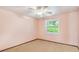 Bedroom with carpet, ceiling fan and window at 26058 Paysandu Dr, Punta Gorda, FL 33983