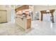 Open-concept kitchen with stainless steel appliances and granite countertops, open to a spacious living area at 26058 Paysandu Dr, Punta Gorda, FL 33983