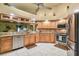 Kitchen with stainless steel appliances, granite countertops and tile flooring at 26058 Paysandu Dr, Punta Gorda, FL 33983