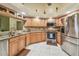 Well-equipped kitchen with stainless steel appliances, granite countertops and ample cabinet space at 26058 Paysandu Dr, Punta Gorda, FL 33983