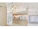 Bright, open floor plan showcasing a kitchen with modern appliances and a breakfast bar at 26058 Paysandu Dr, Punta Gorda, FL 33983