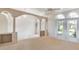 Bright living room featuring elegant archways, lots of natural light, and neutral carpet at 26058 Paysandu Dr, Punta Gorda, FL 33983