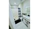 Well-maintained bathroom showcasing a modern vanity and a shower with sleek black fixtures at 9151 Bay Dr, Spring Hill, FL 34606