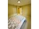 Comfortable bedroom featuring neutral wall paint, pristine tile flooring, and a cozy atmosphere at 9151 Bay Dr, Spring Hill, FL 34606